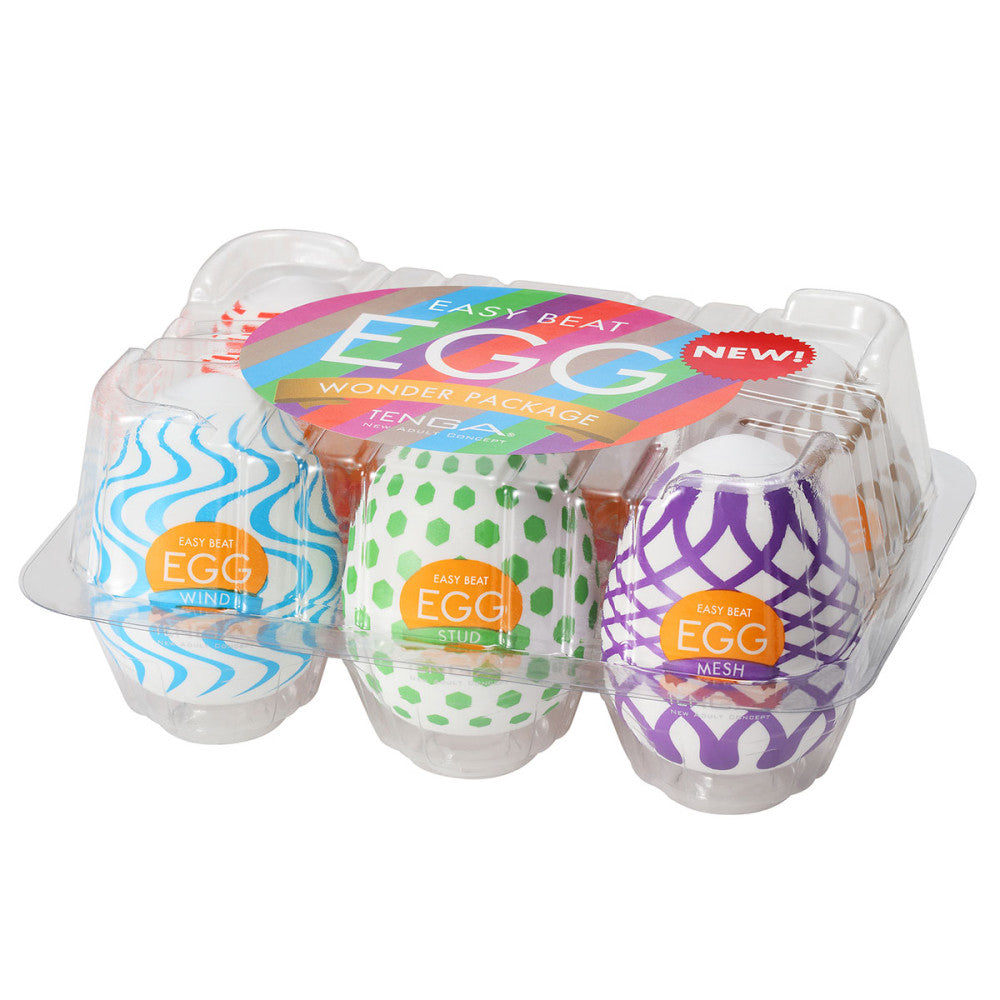 Packaged eggs with colorful designs and labels on a white background